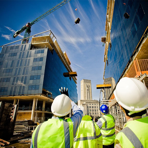 construction crew members looking at construction site