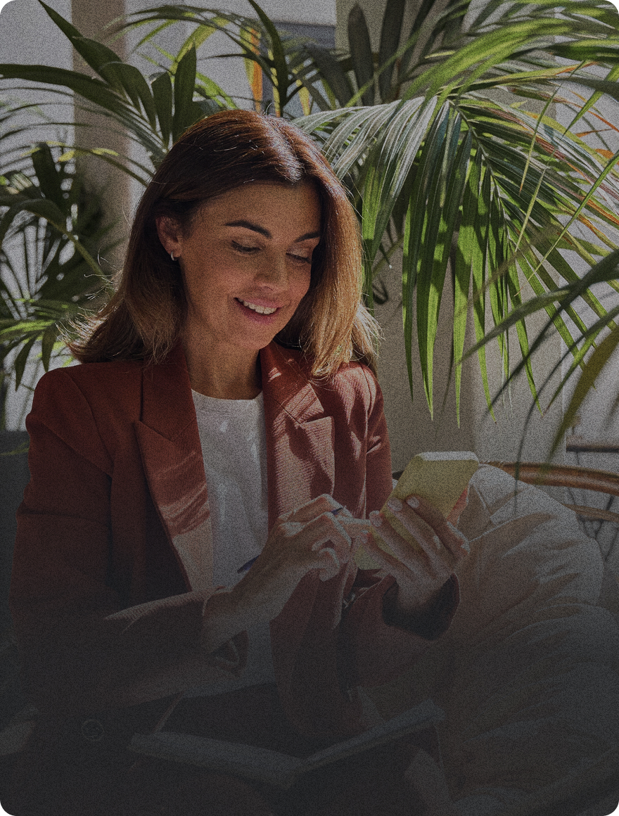 woman using cellphone with dark overlay